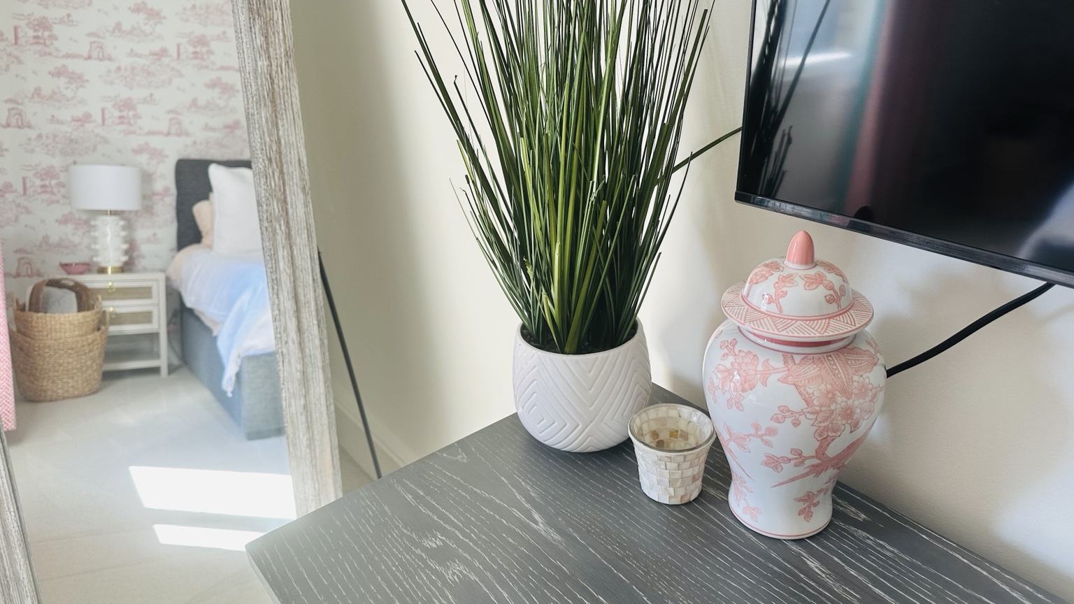 A bright pink ginger jar bringing fresh color to a spring interior